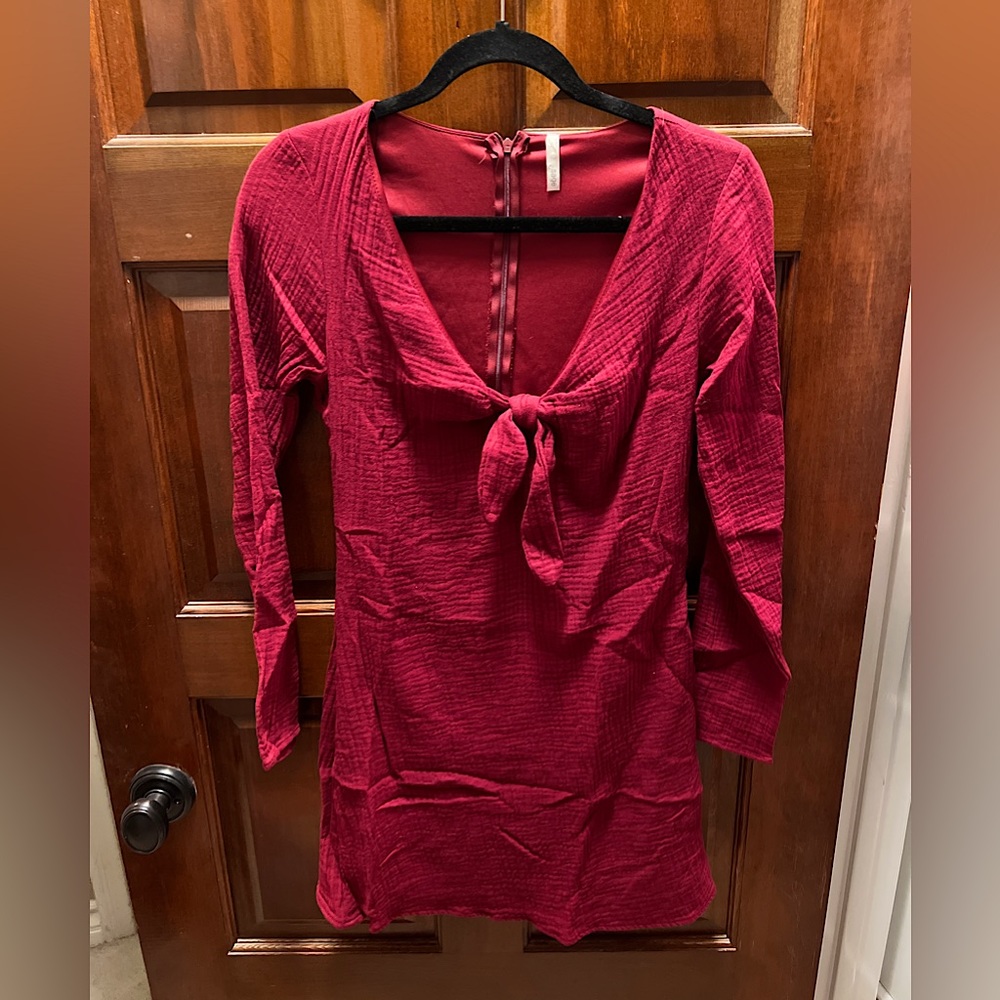 Super cute red flattering mini dress with tie in front by Sage!